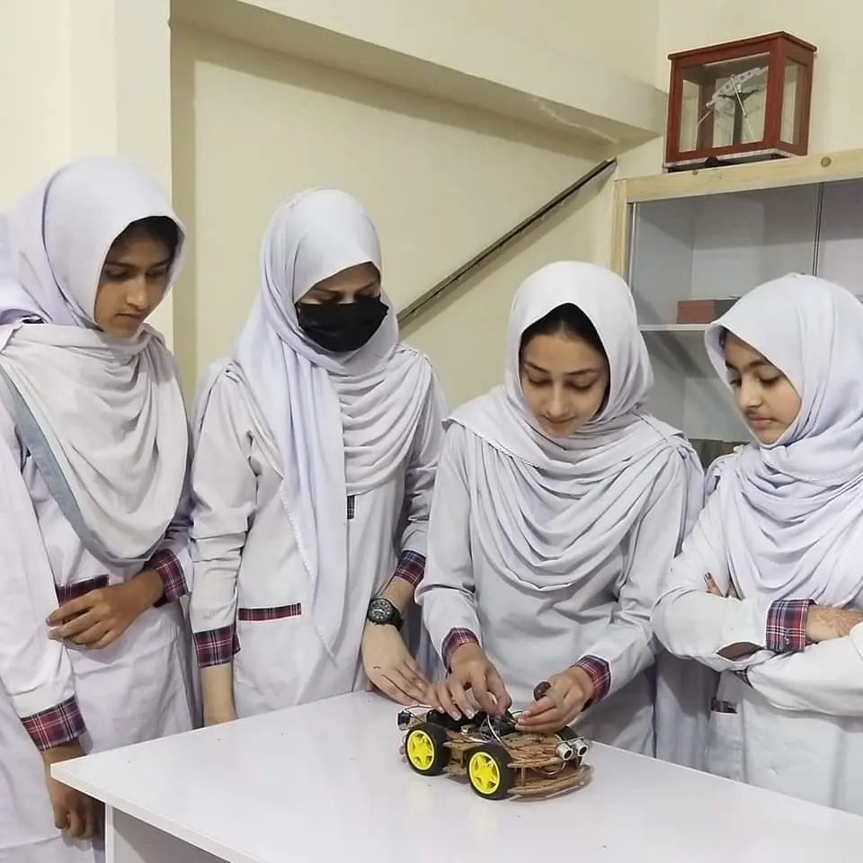 Girls-Collaborating-on-a-Robotics-Project-in-a-Classroom-Smile-School-and-college